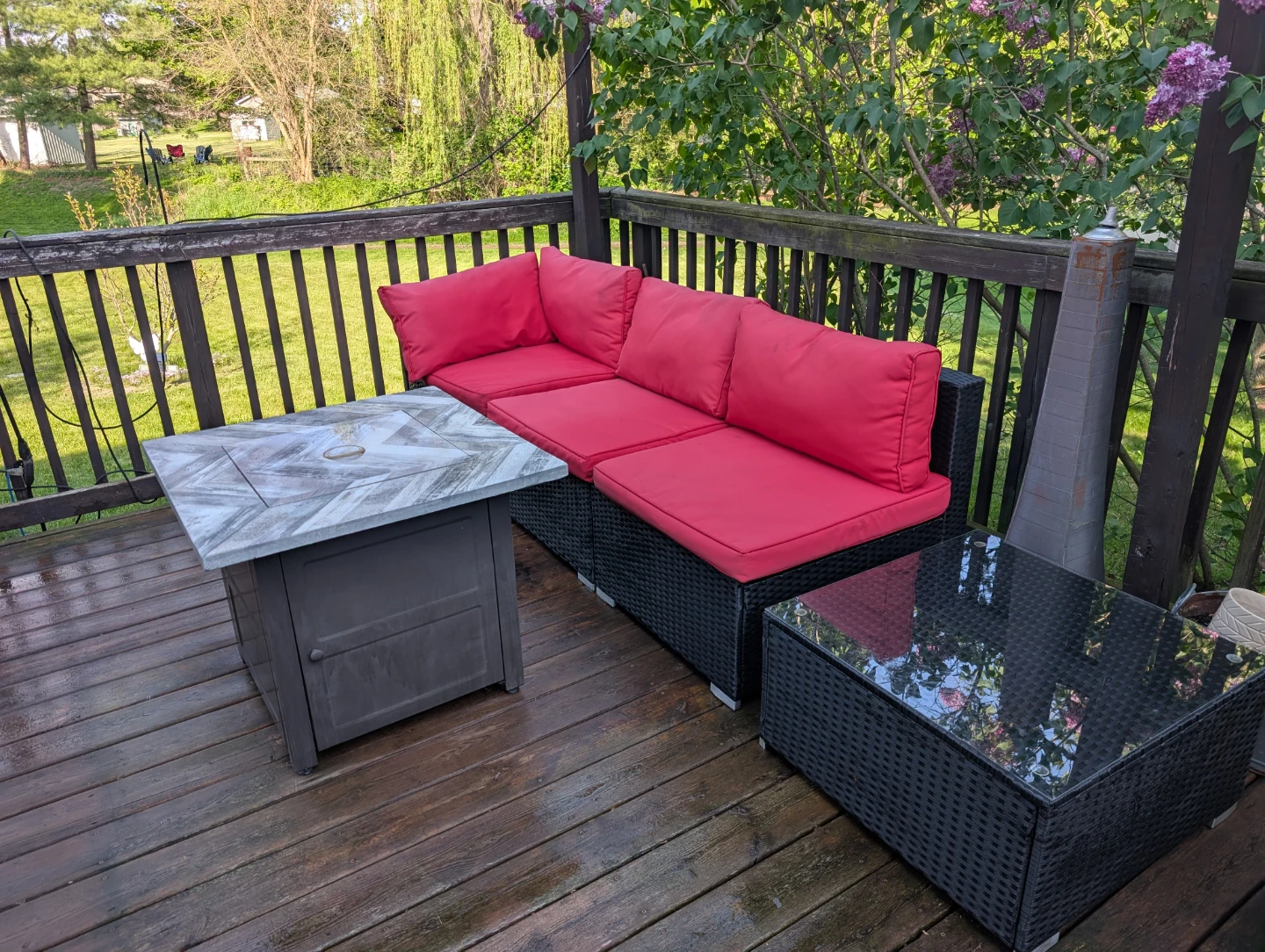 Wicker outdoor sectional sofa with red cushions