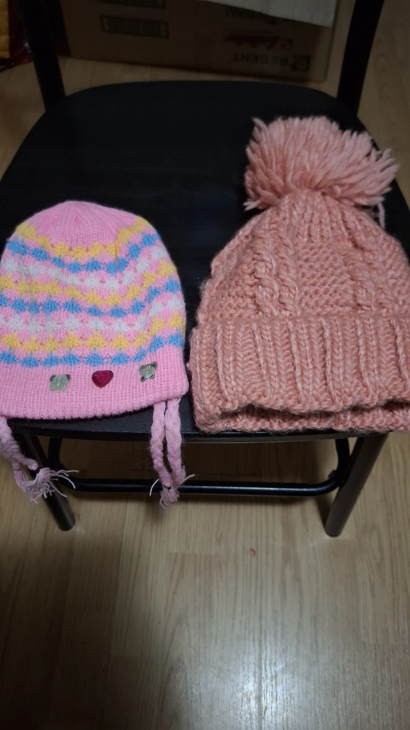 2 Pink knitted hats with pom-pom