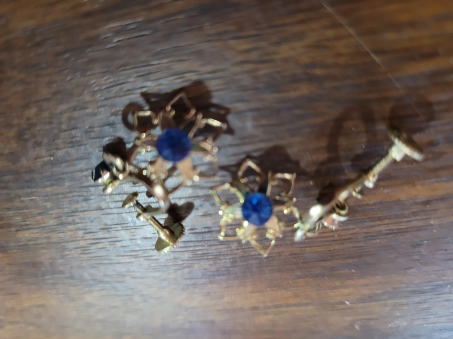 Gold-tone screw-back earrings with blue gems