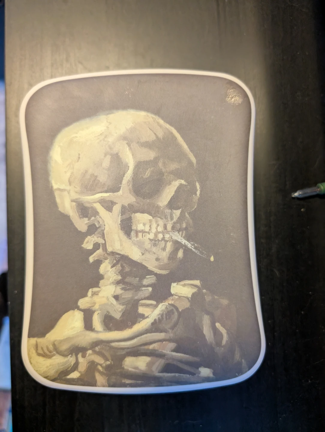 Skull of a Skeleton with Burning Cigarette