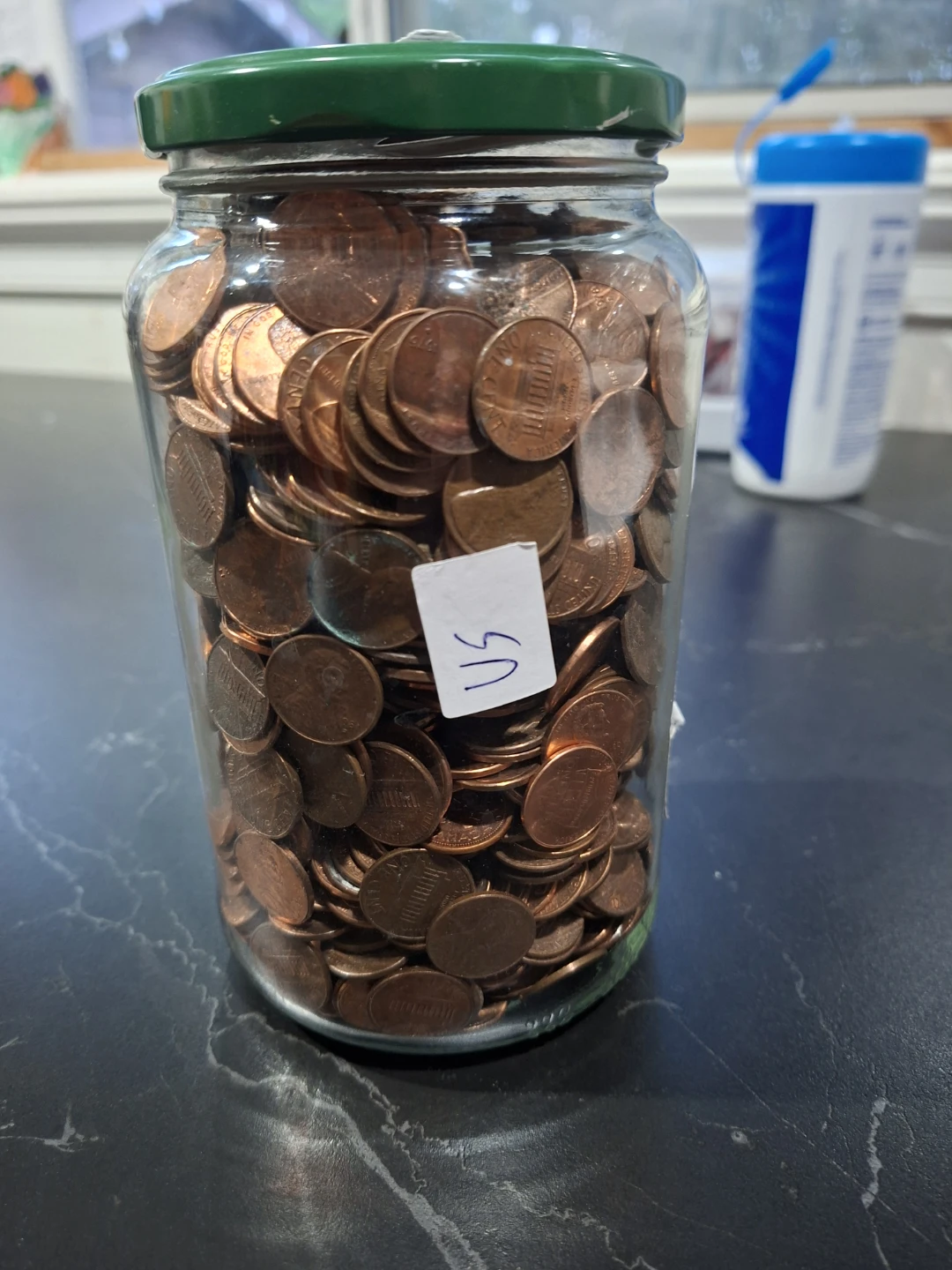 Large pickle Jar full of US Pennies