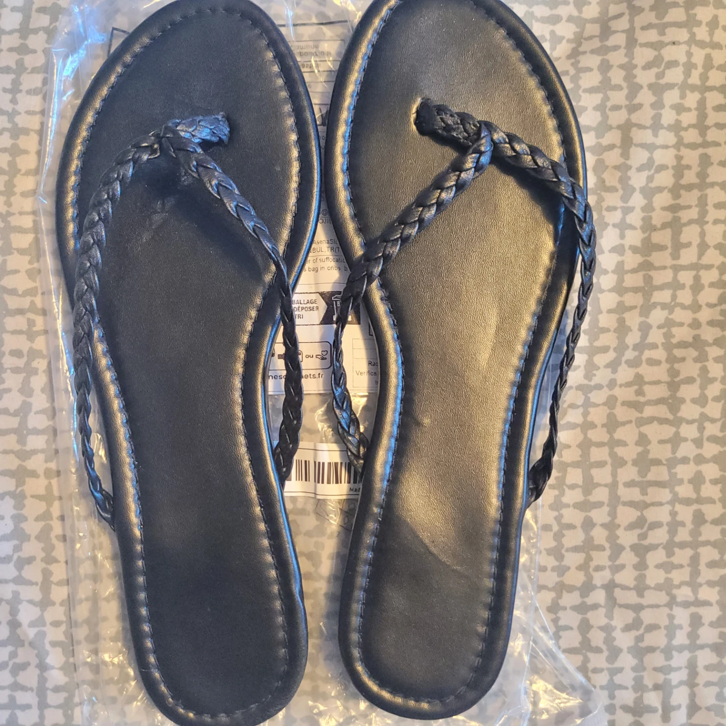Black Flip Flops. New in plastic seal.