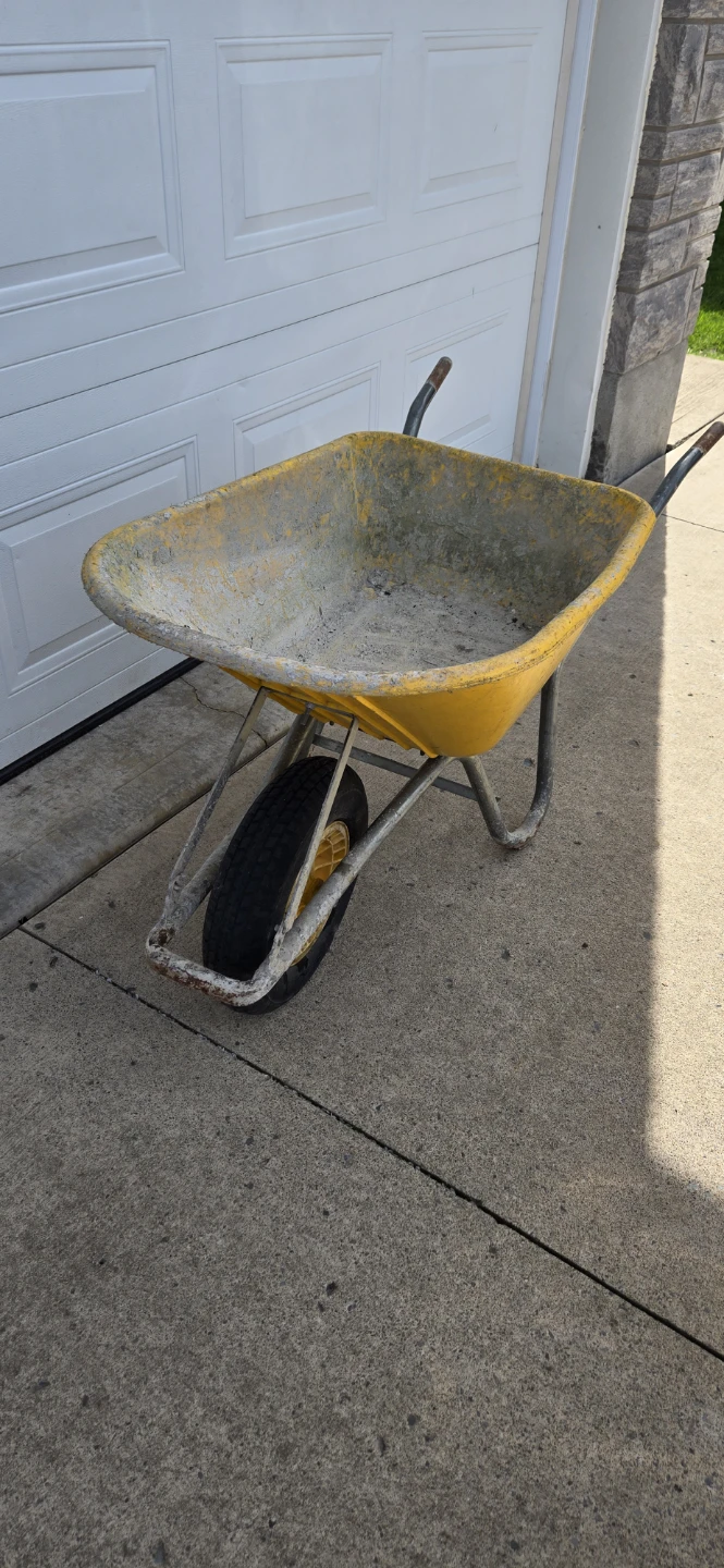 Yellow single-wheel wheelbarrow