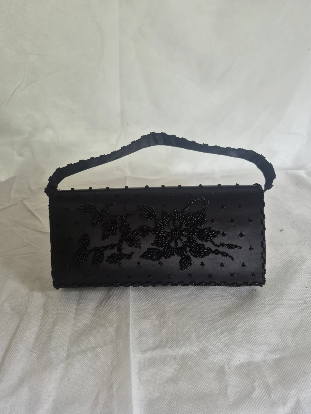 Black beaded clutch purse with floral design