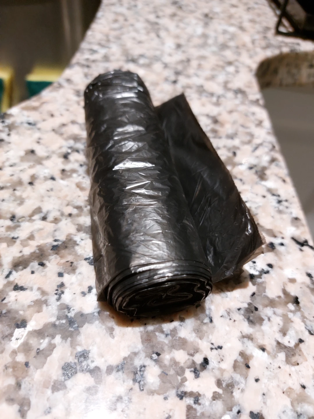 Small roll of black plastic bag - photo 2