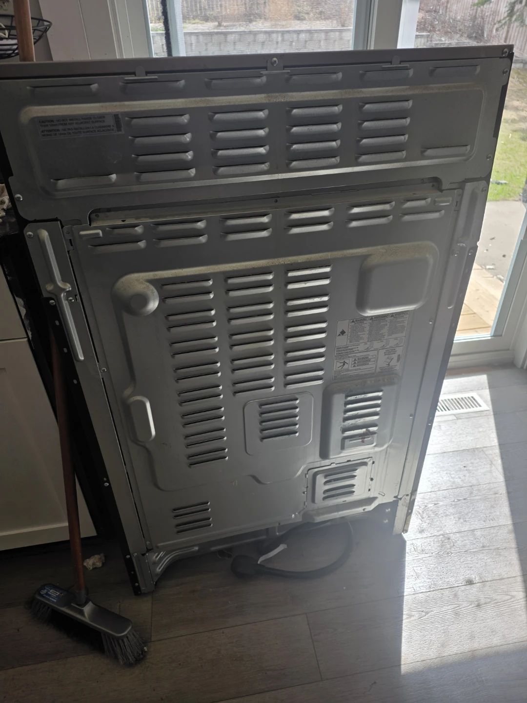 Rear view of a stainless steel appliance