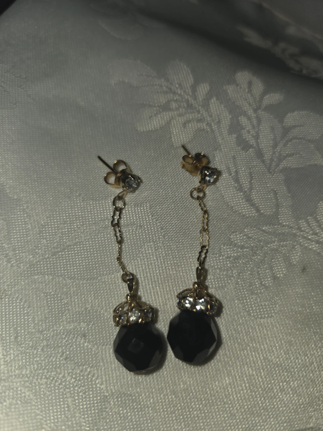 Black faceted bead dangle earrings with gold chain