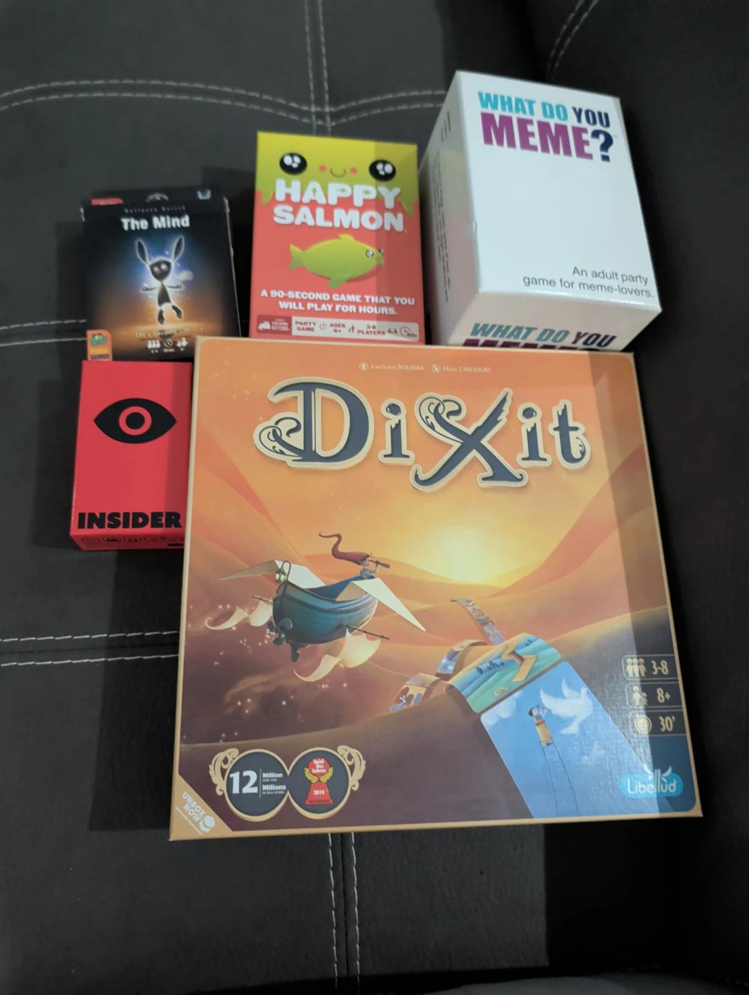 Dixit, The Mind, Happy Salmon, What Do You Meme?, and Insider