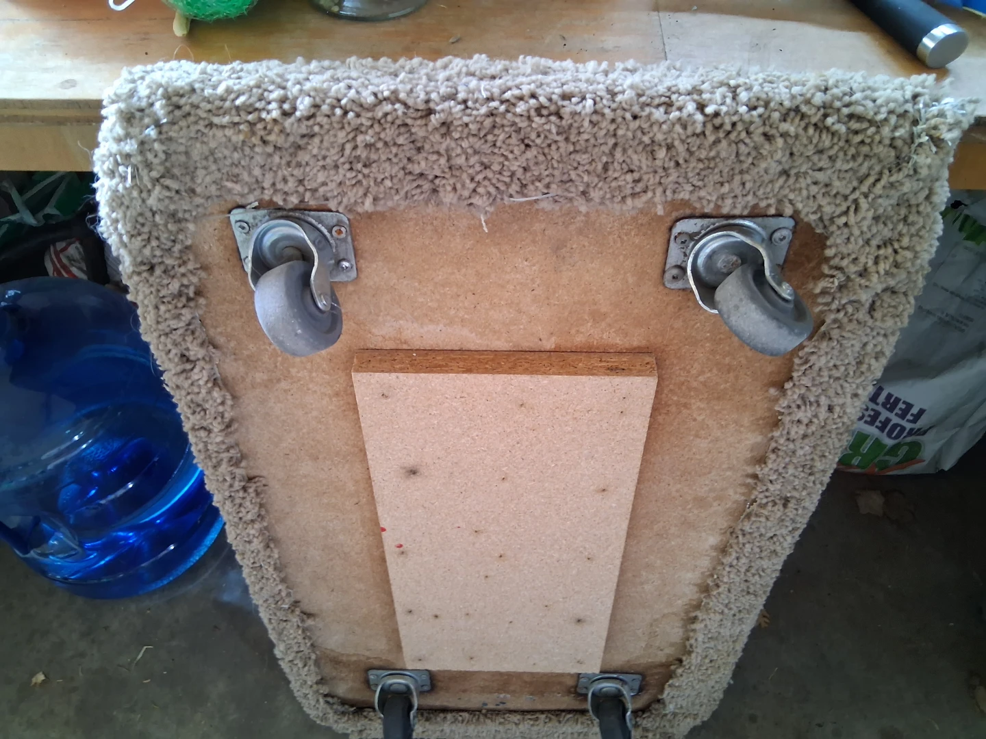 Carpeted Ottoman with Wheels