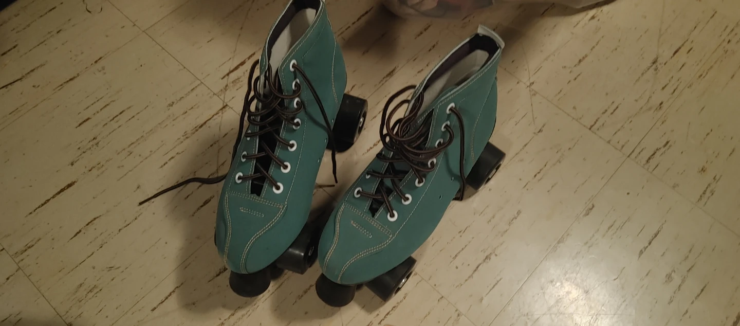 Vintage teal suede roller skates
