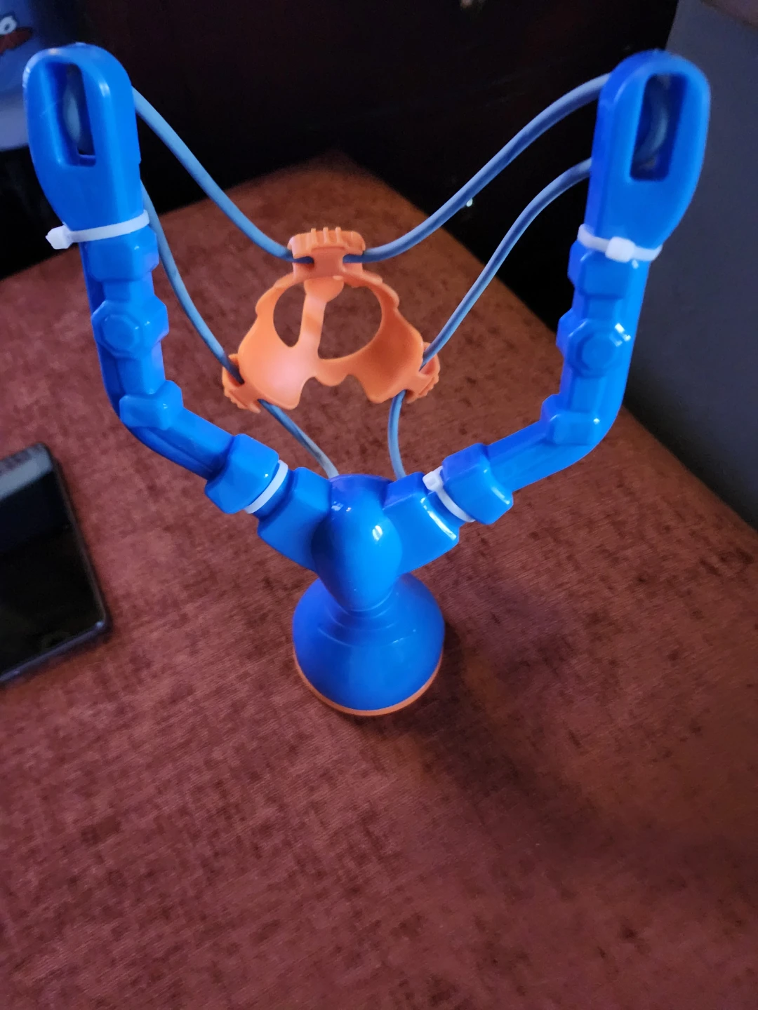 Blue and Orange Slingshot Toy