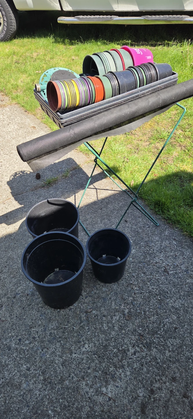 Assorted Plastic Plant Pots and Black Landscape Fabric Roll
