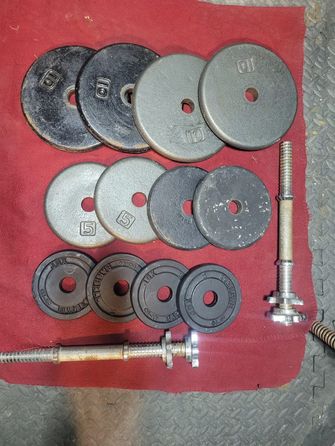 ADJUSTABLE  DUMBBELLS 1" HOLE  70LBs.   4-10s  4-5s. 4-2.5s