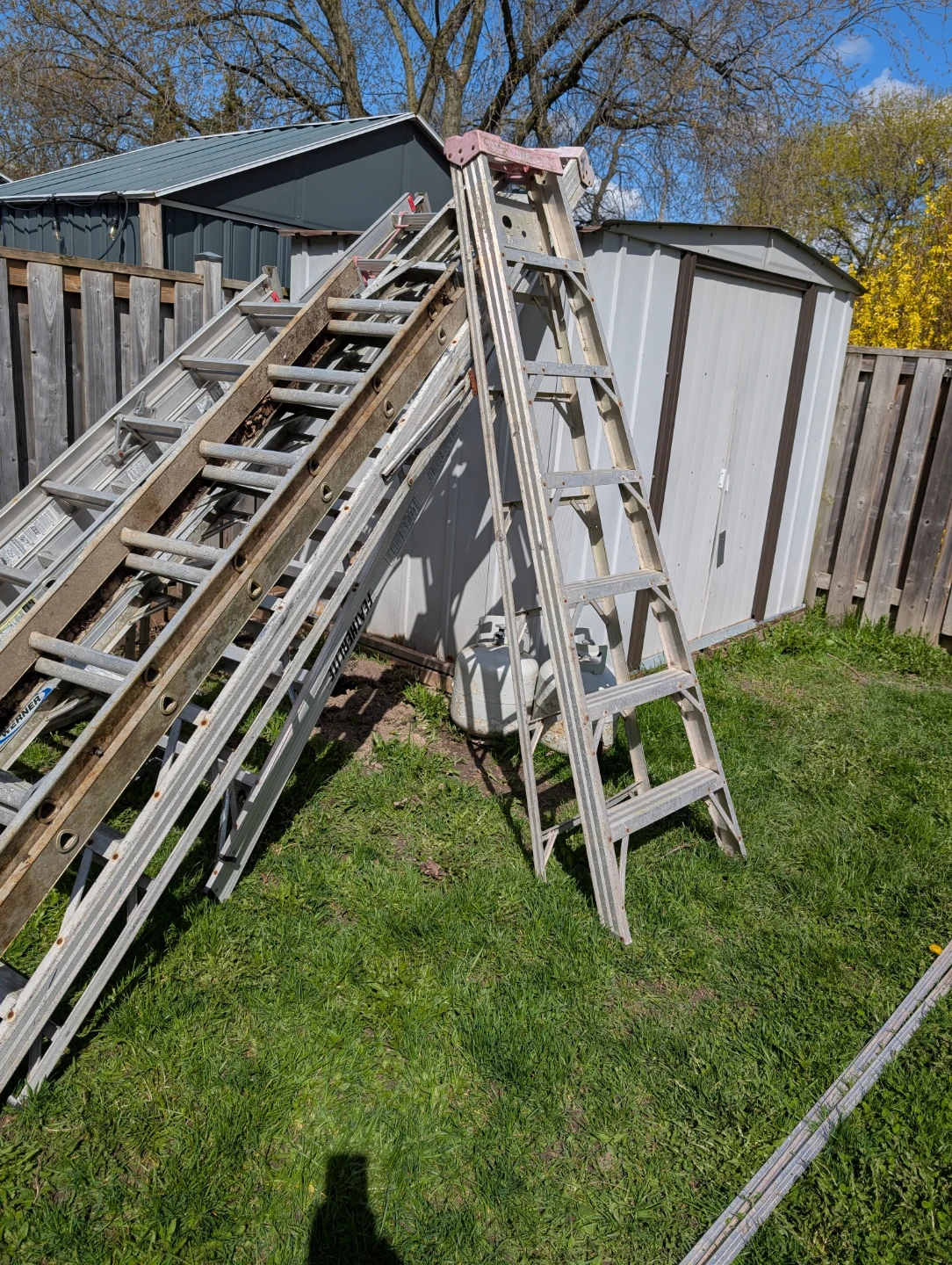 8 Ladders for$150. Featherlight Werner Aluminum Extension Ladder