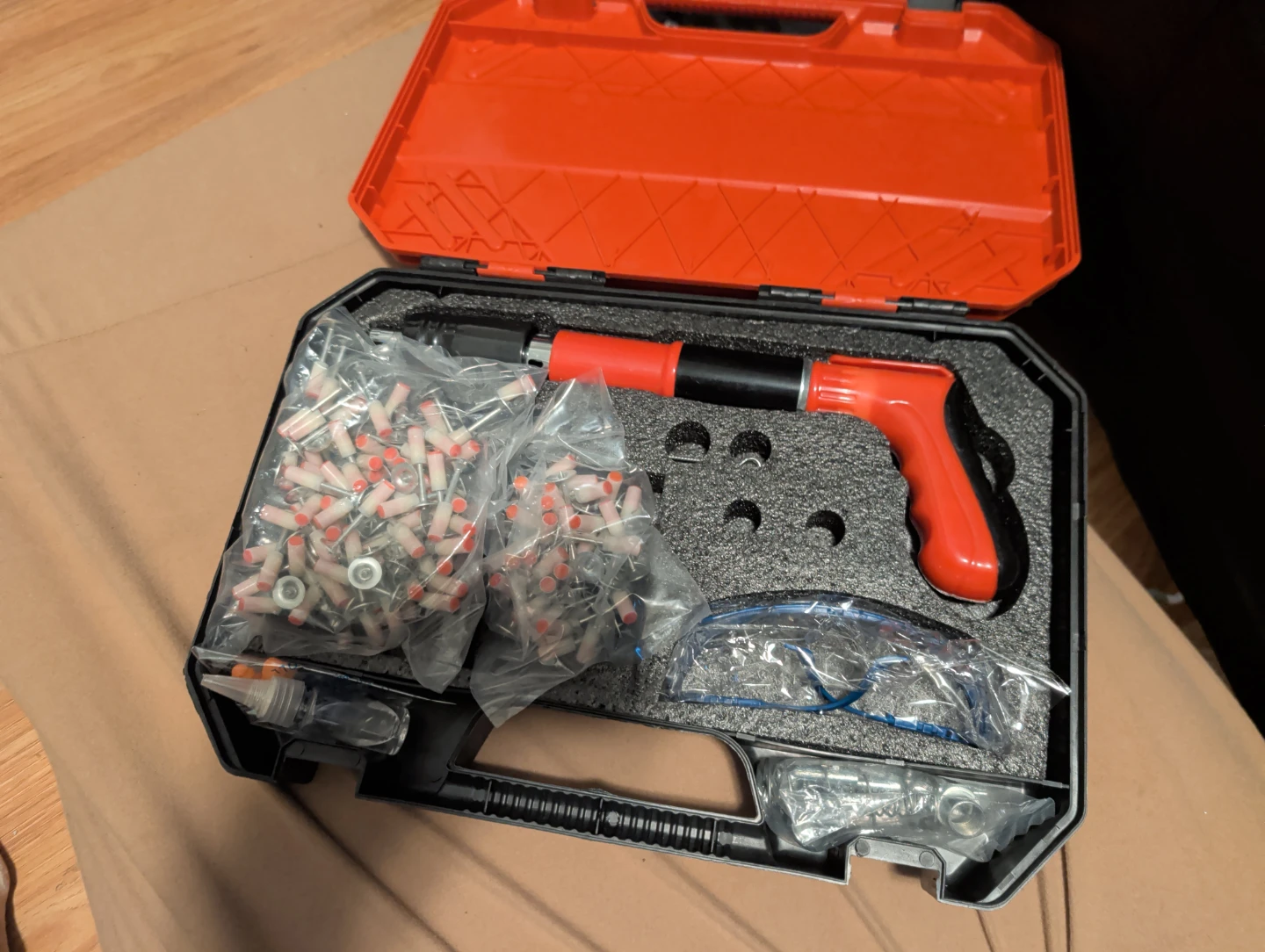 Powder actuated concrete nail gun