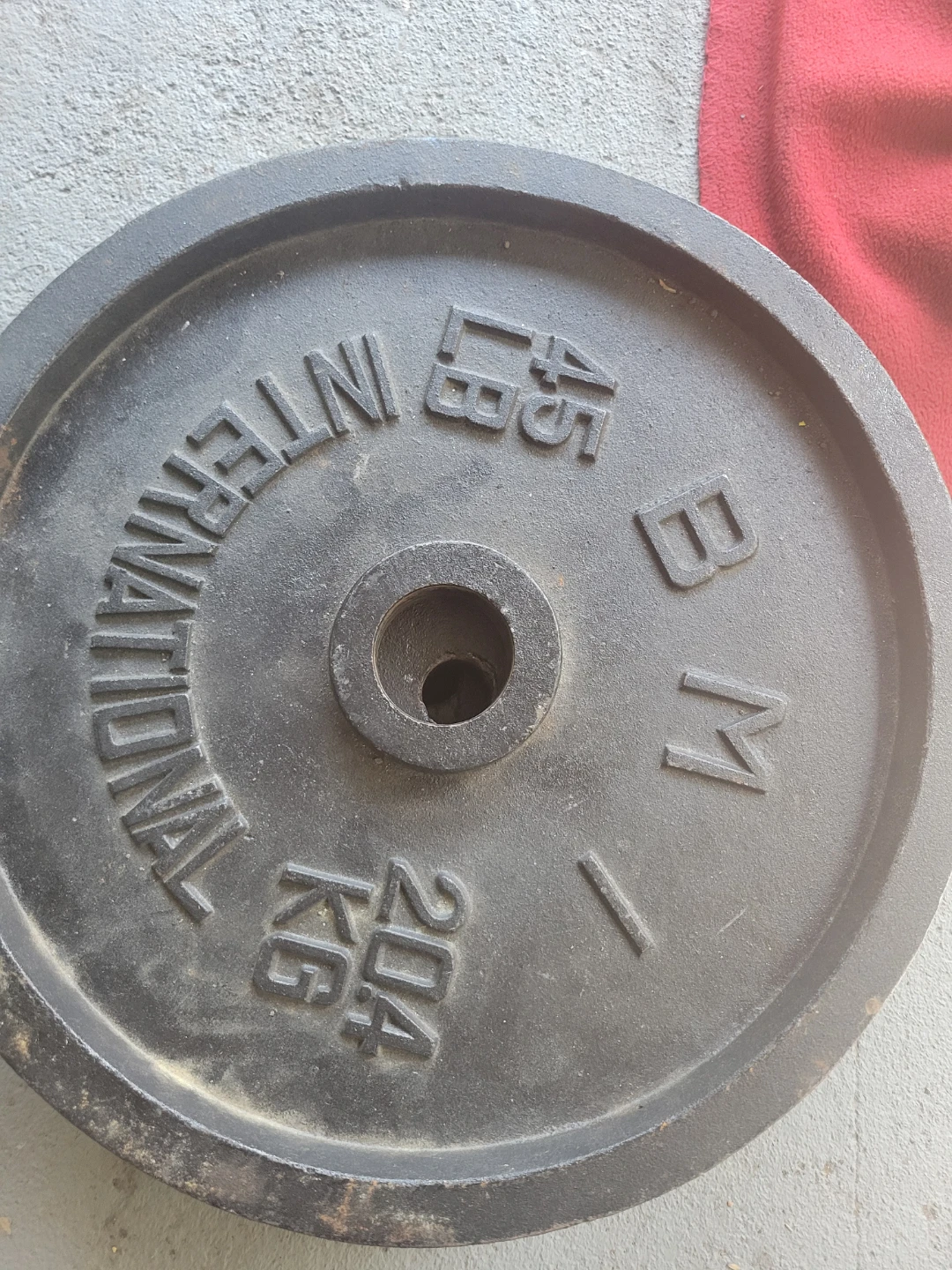 BMI. OLYMPIC 2" HOLE.  45LBs. PLATES 90LBs. TOTAL