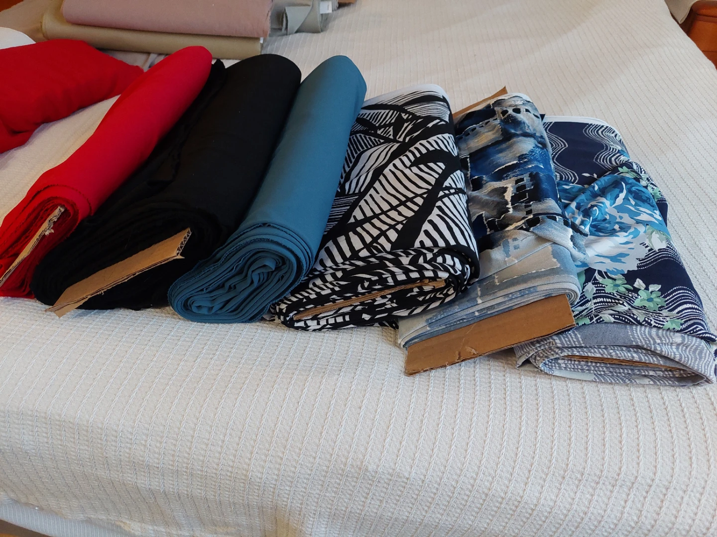 Rolls of assorted fabrics. - photo 2