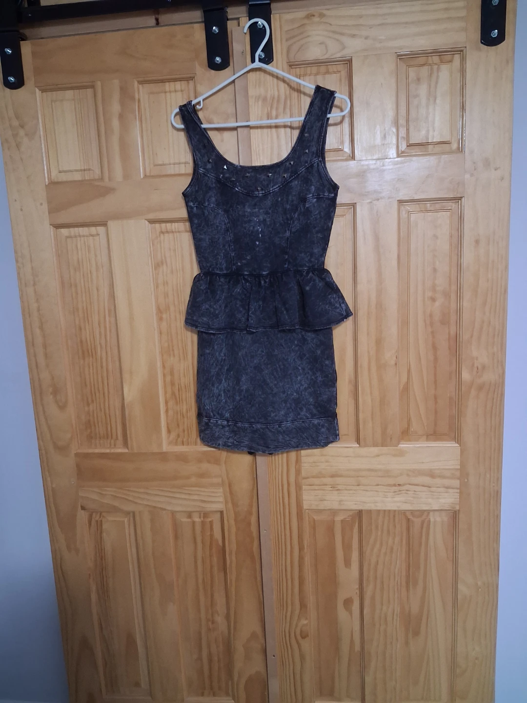 Black acid wash peplum dress with studs
