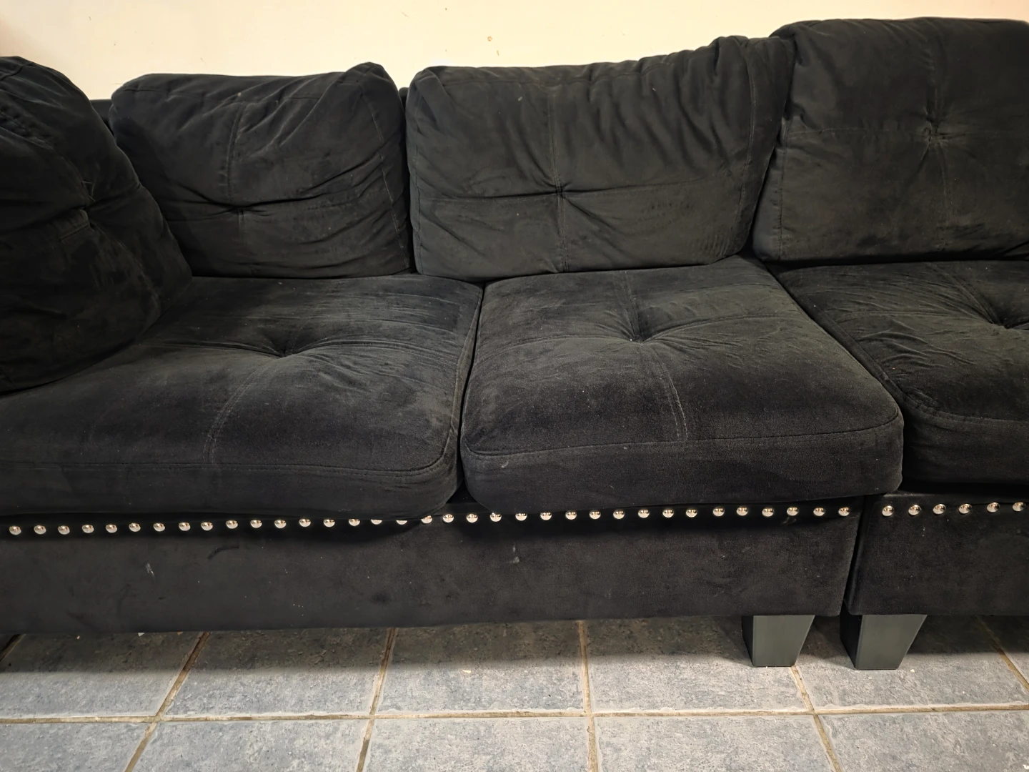 Black Velvet Sectional Couch with Stud Detailing