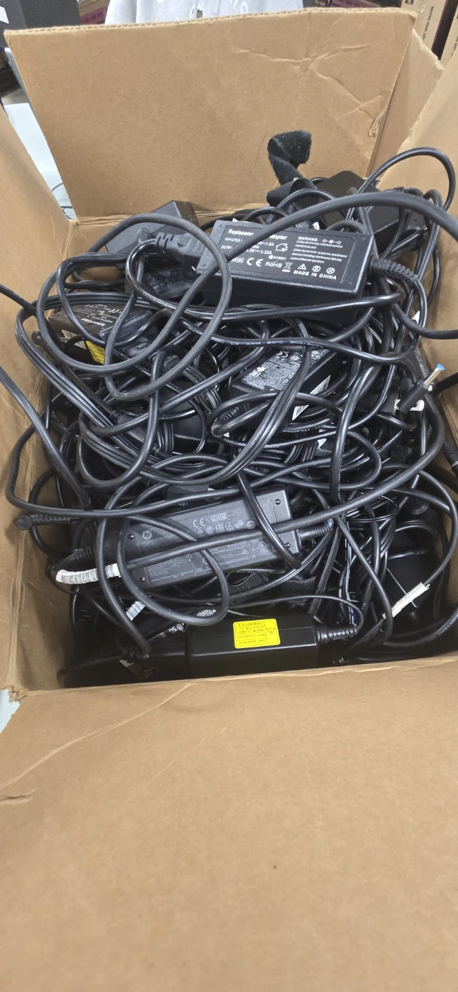 Box of AC Adapters and Power Cords
