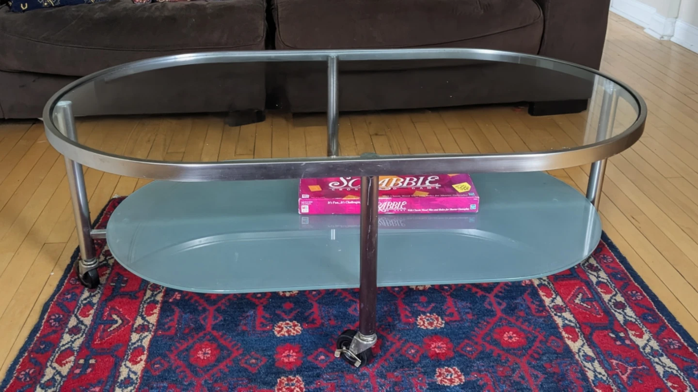 Oval Glass Top Coffee Table with Wheels