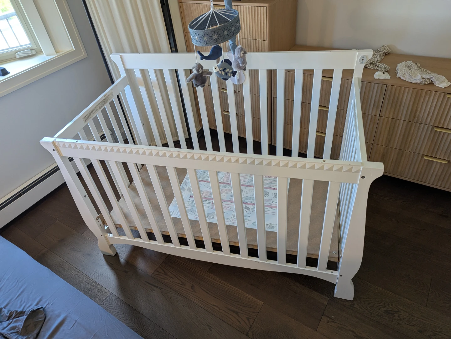 White Wooden Baby Crib with Mobile
