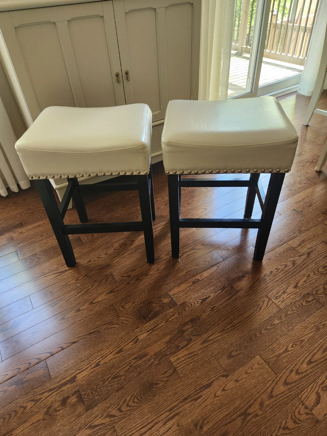 Pair of white leatherette bar stools