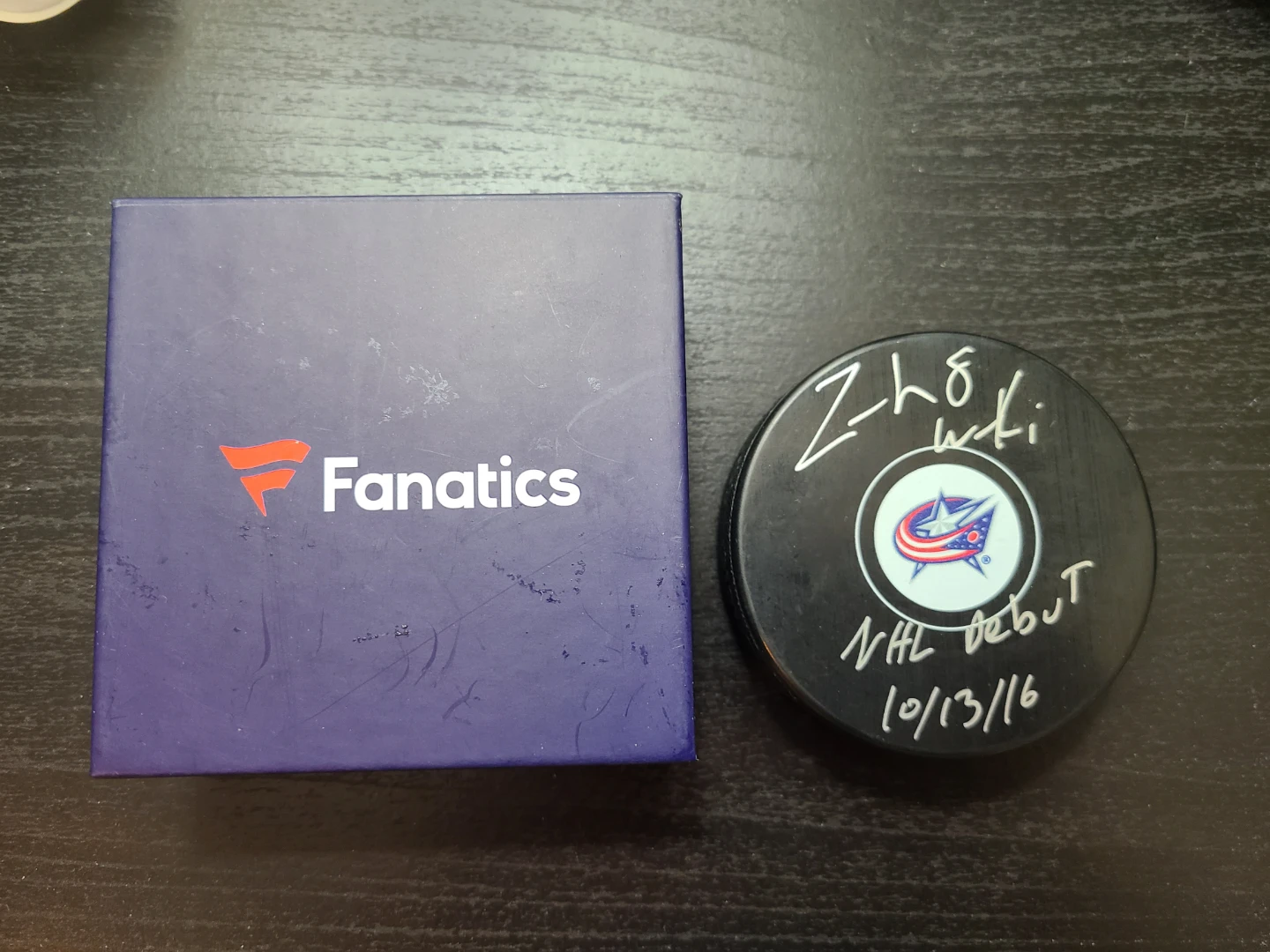 Signed Zach Werenski puck, with NHL debut date