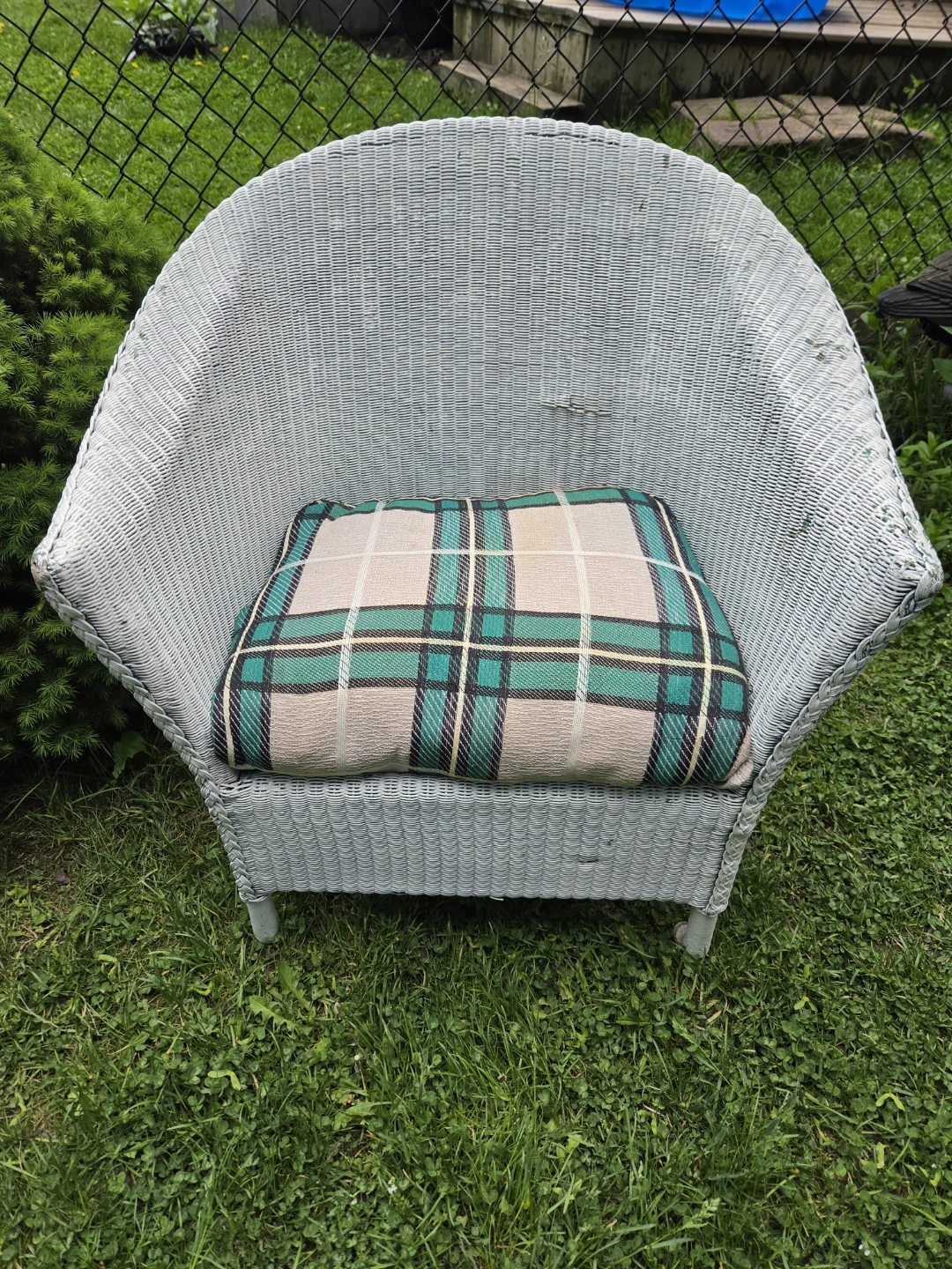 Light Blue Wicker Chair with Plaid Cushion