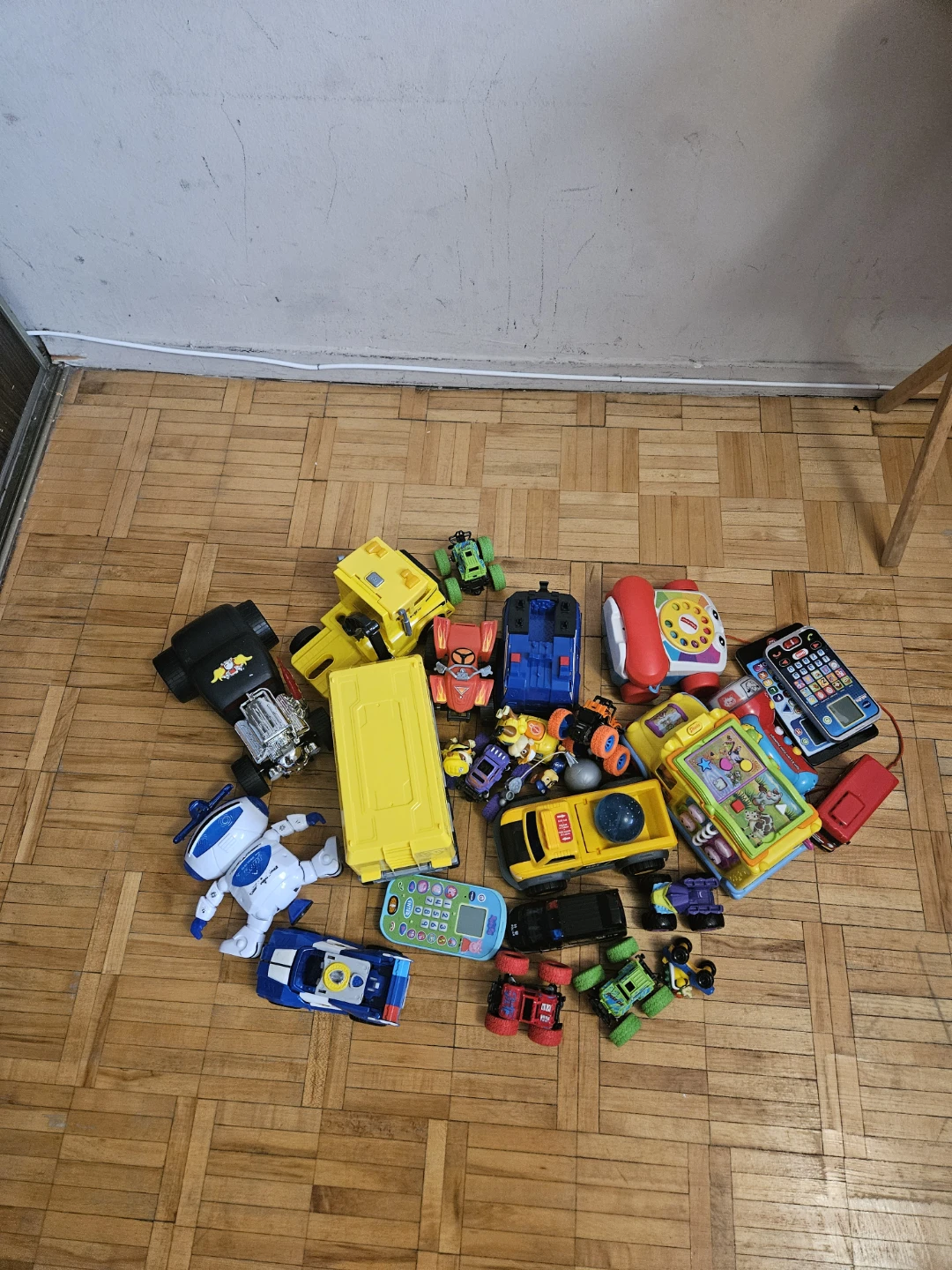 Assorted Toy Cars, Phones, and Robot