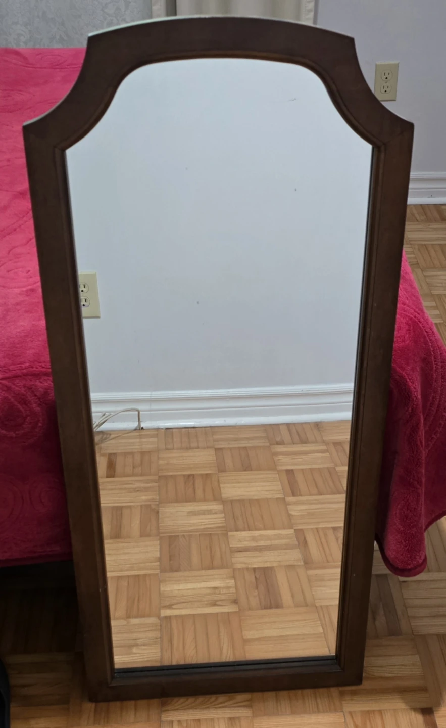 Tall wooden framed mirror