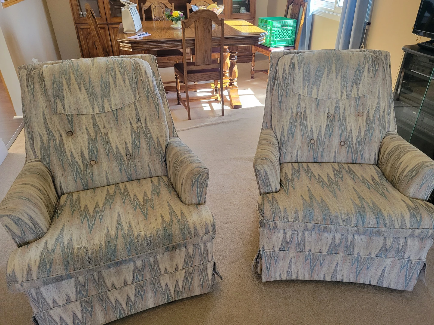 Two upholstered accent swivel rocker chairs