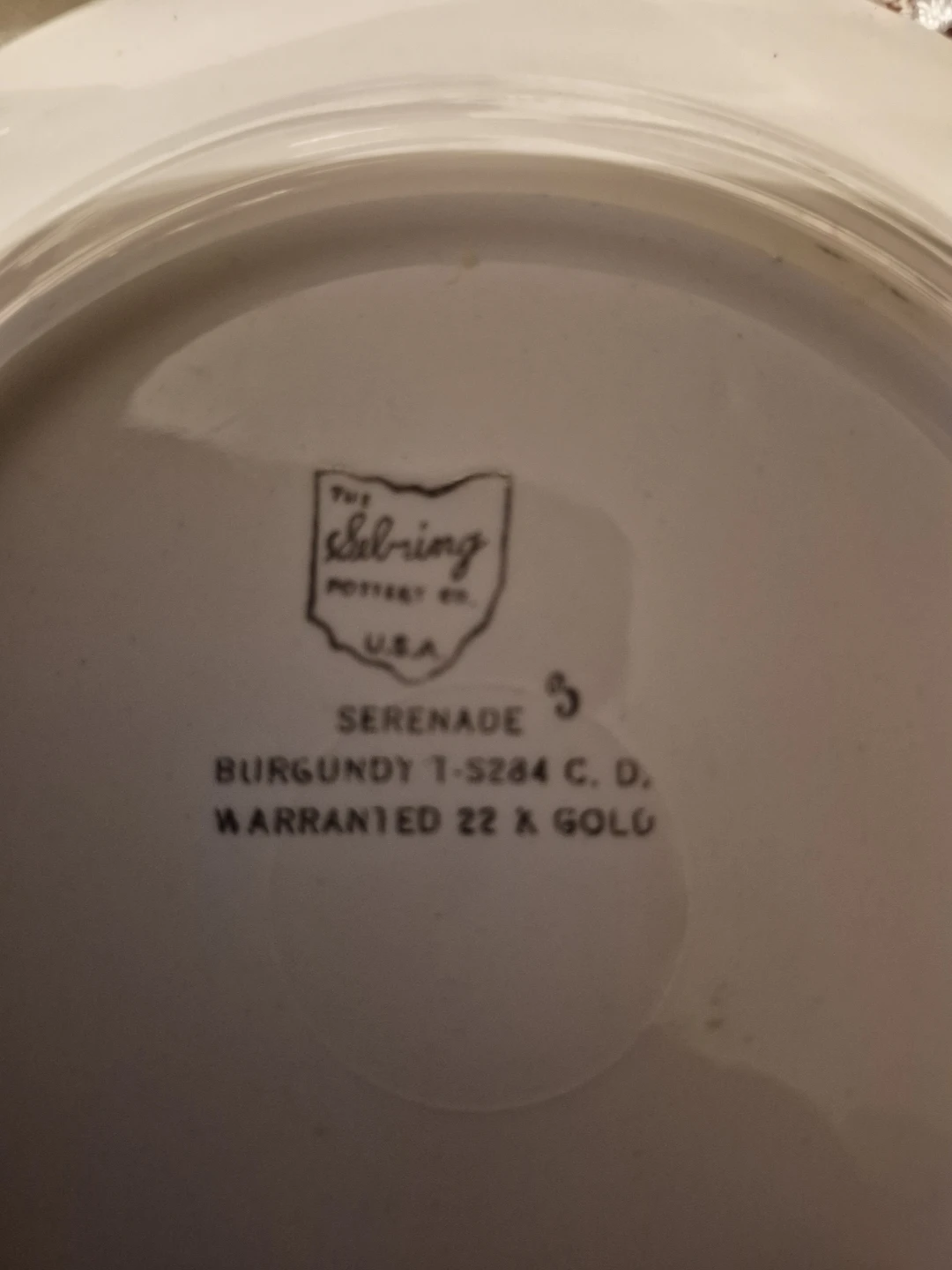 The Sebring Pottery Serenade Burgundy Dinnerware Set
