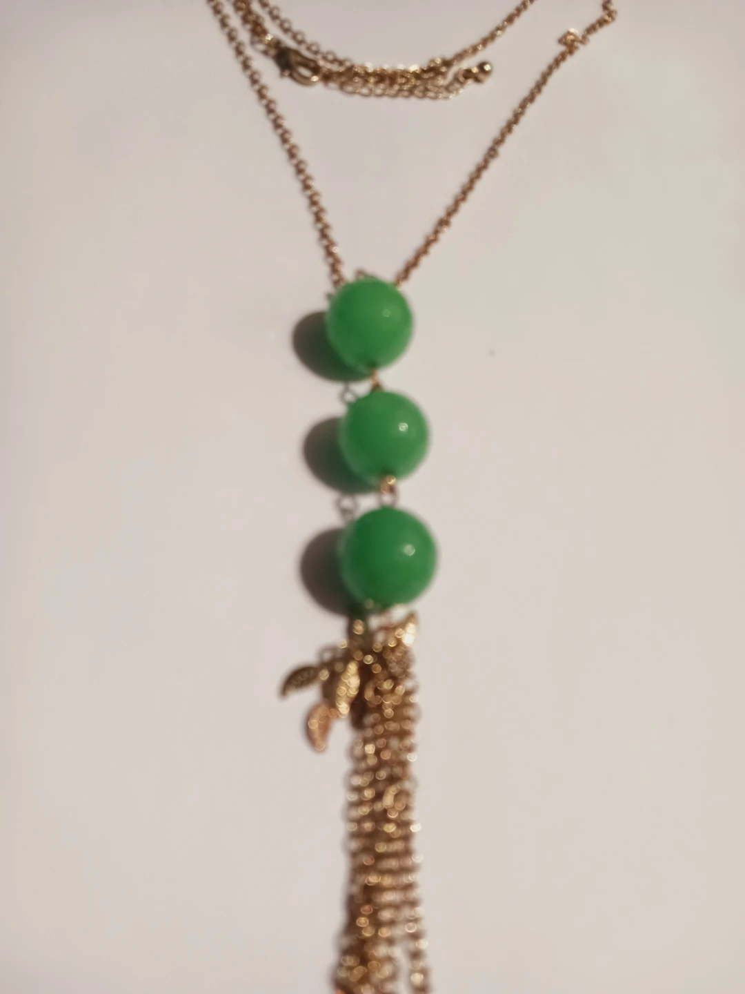 Gold tone necklace with green beads and tassel - photo 4