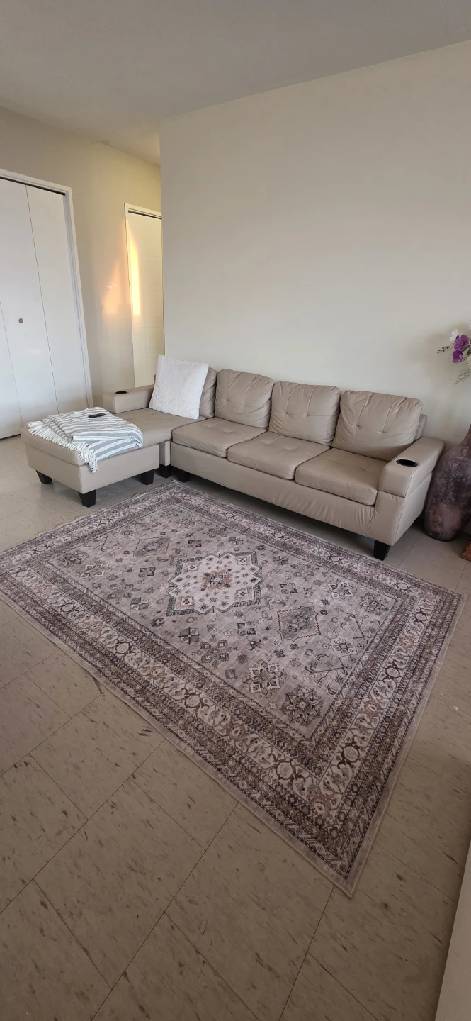 Beige Faux Leather Sectional Sofa with a reversible Chaise