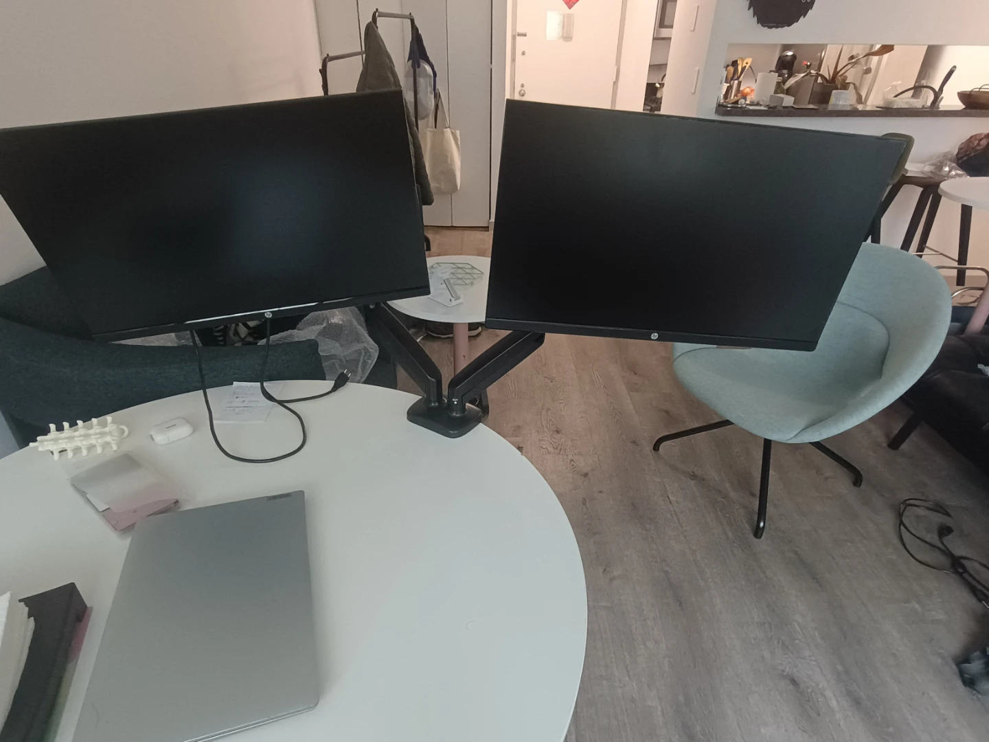 Double monitors mounted in a single arm