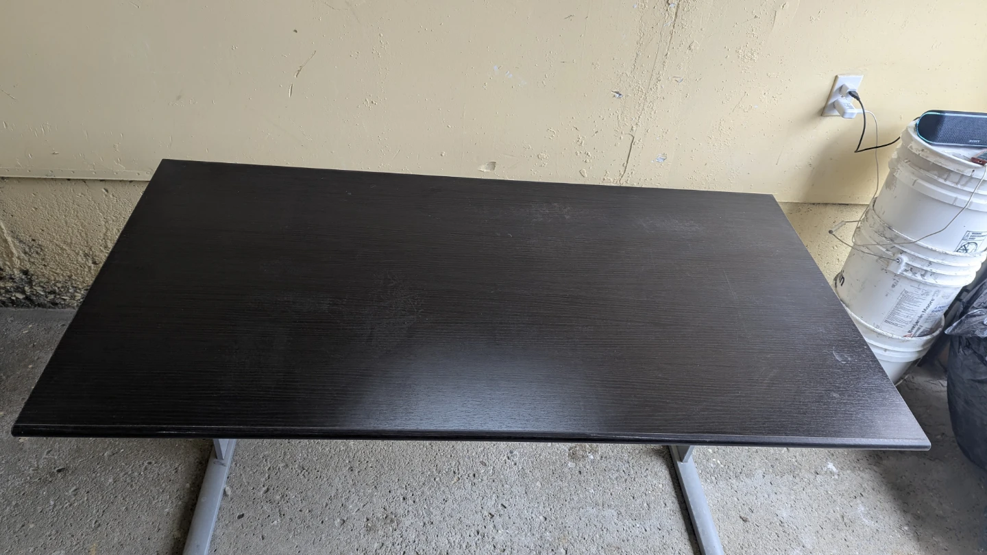Dark brown desk with metal legs