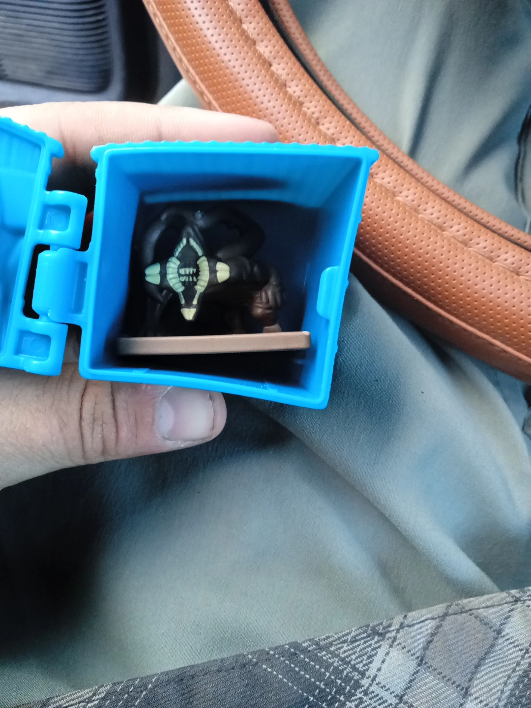 Mystery Figure in Blue Container