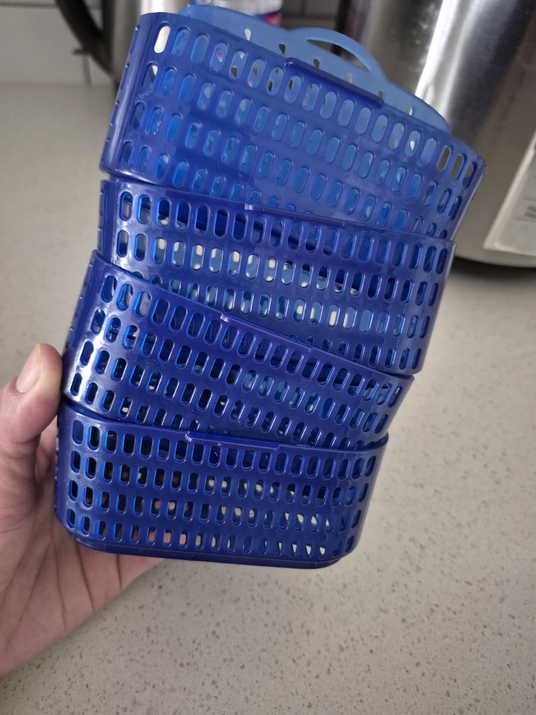 Stack of Blue Plastic Baskets
