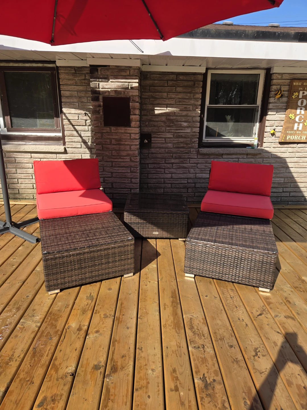 Wicker patio furniture set with red cushions