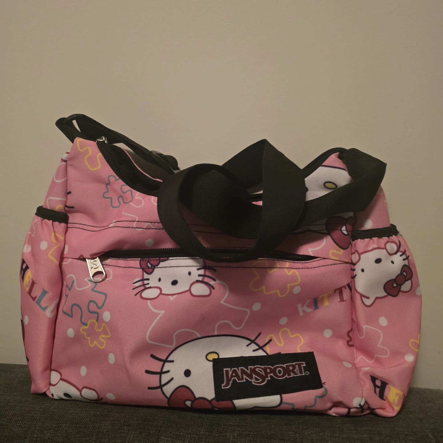 JanSport Hello Kitty Pink Puzzle Crossbody Bag