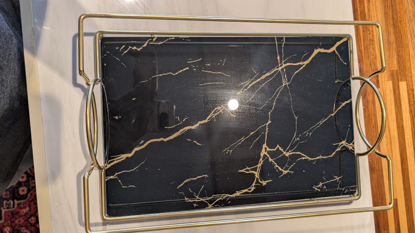 Golden and black tray