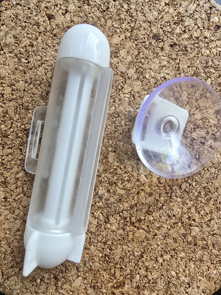 tube squeeze with White Plastic Suction Holder