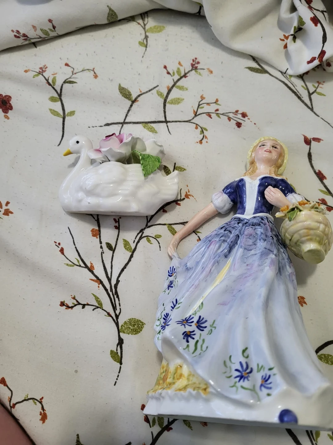 Two Porcelain Figurines: Woman with Basket and Swan Planter