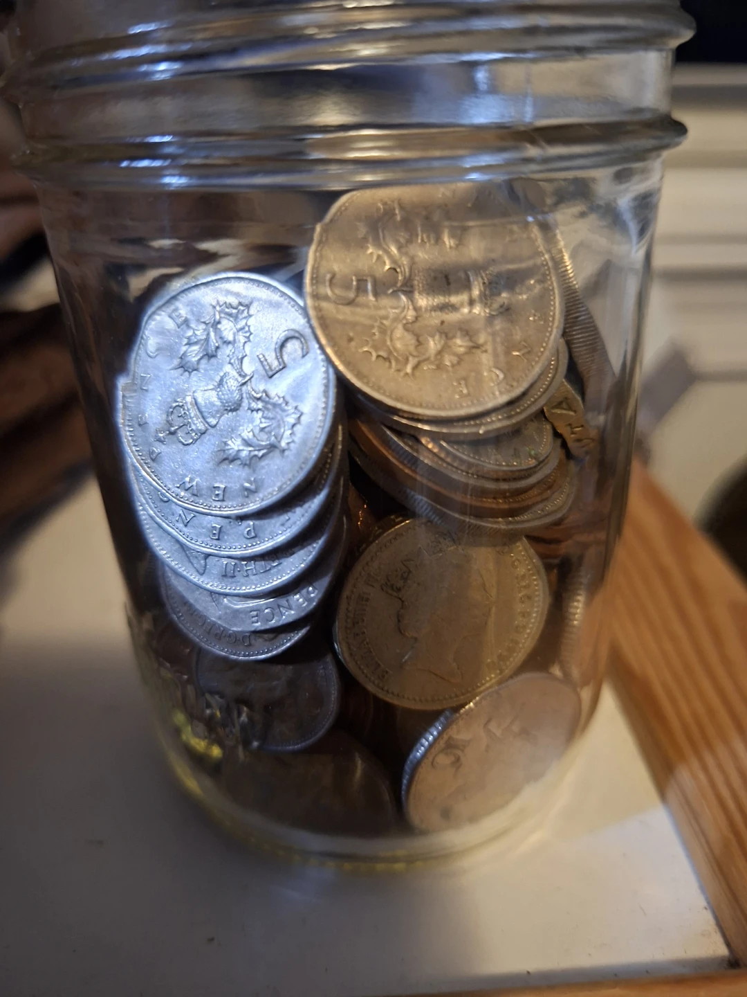 Jar full of modern British coins - photo 4