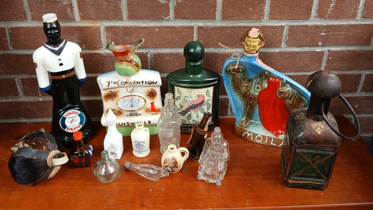 Collection of 9 Decorative Liquor Bottles