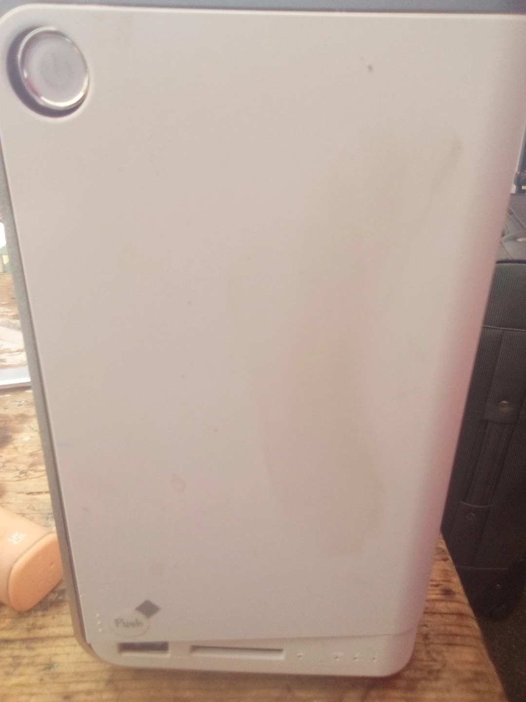 White Device with Push Button