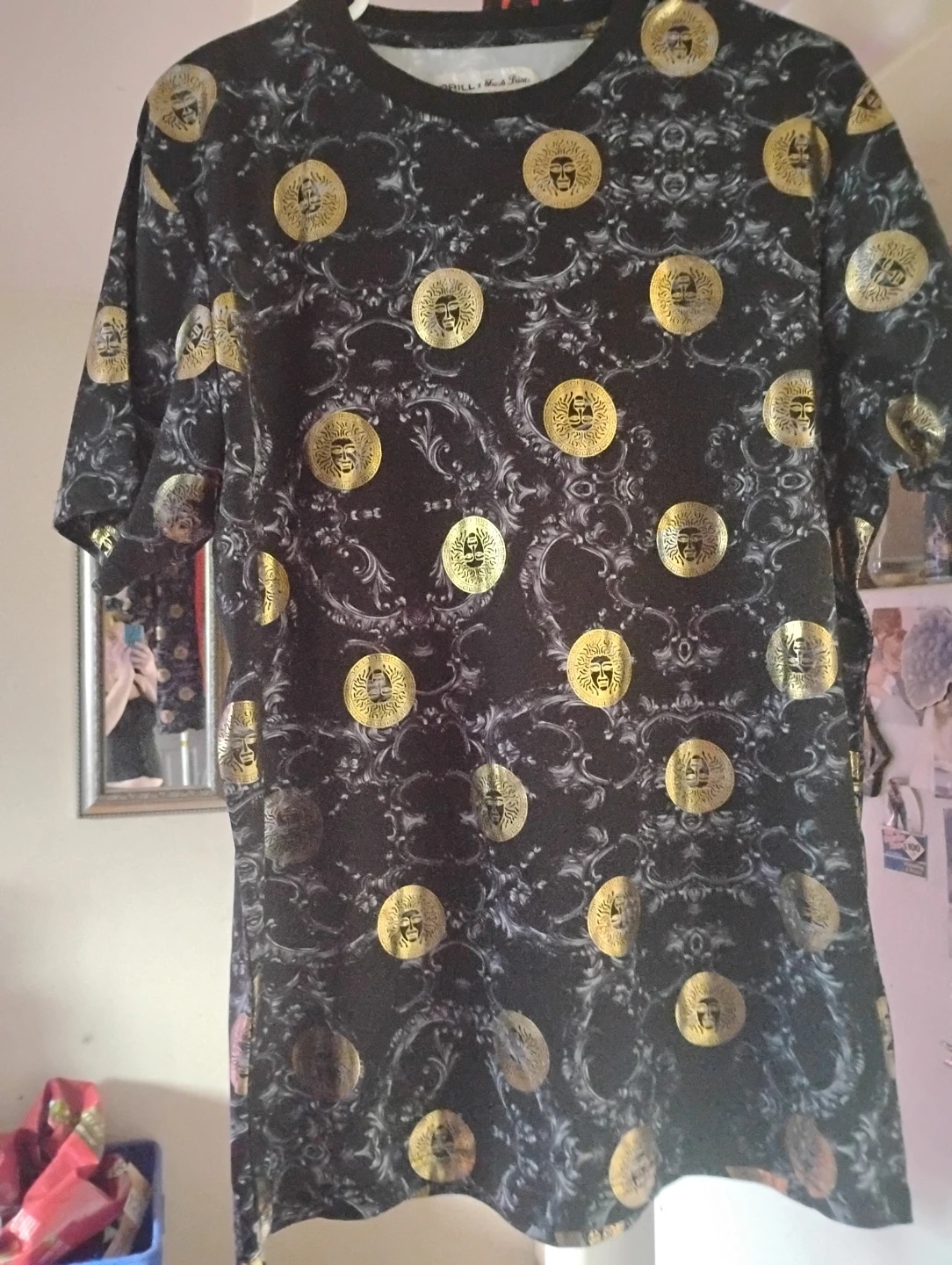 Black t-shirt with gold coin pattern