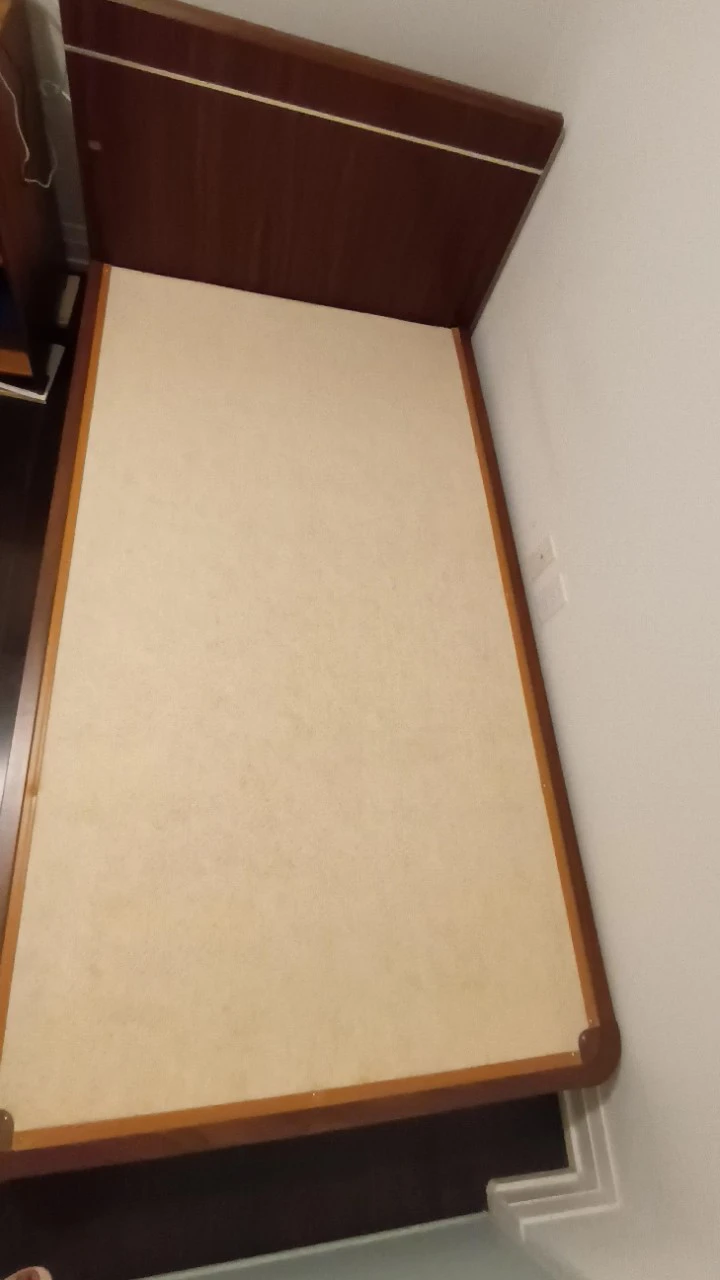 Wooden bed frame with upholstered base