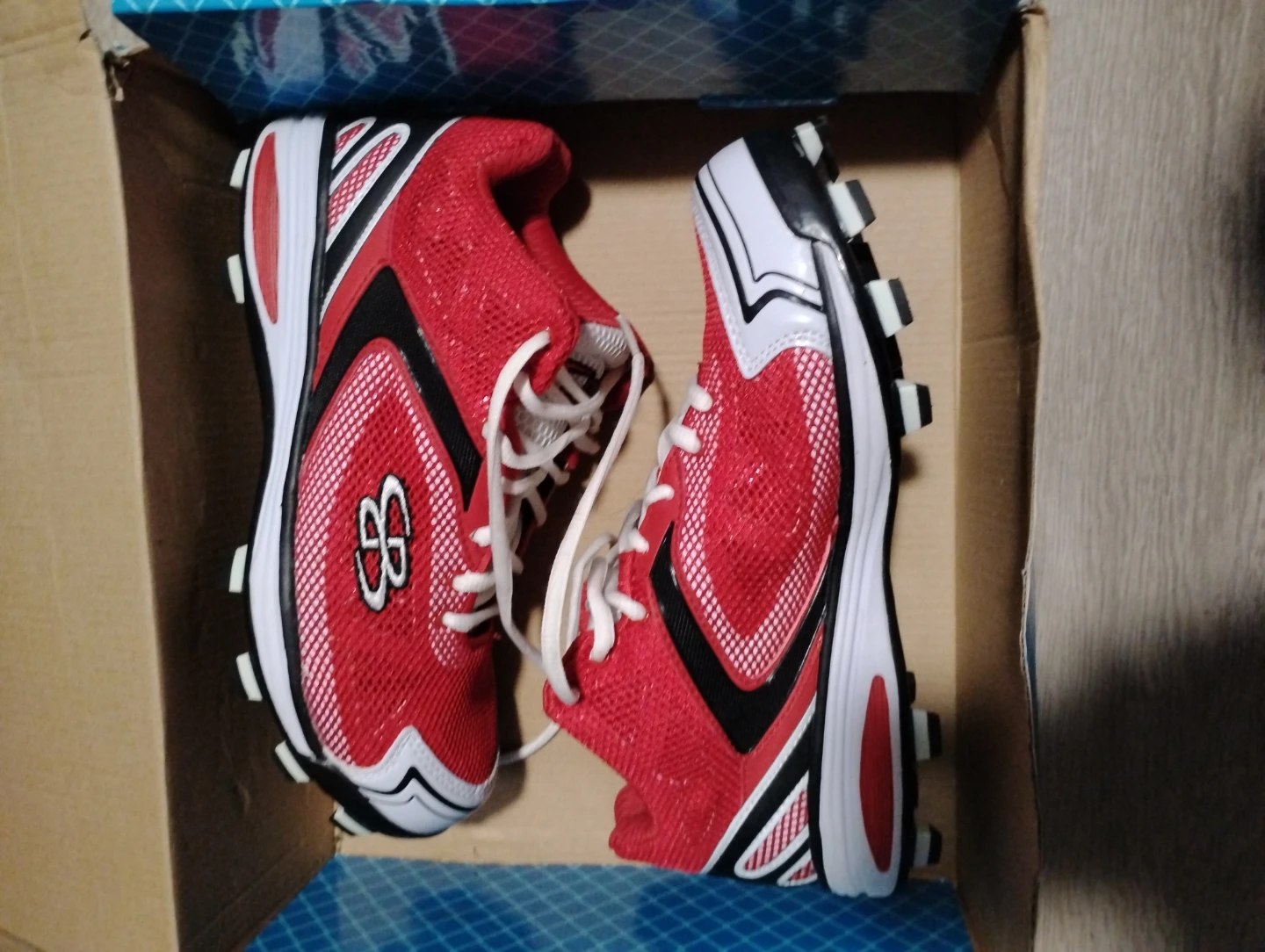 Red and Black Baseball Cleats